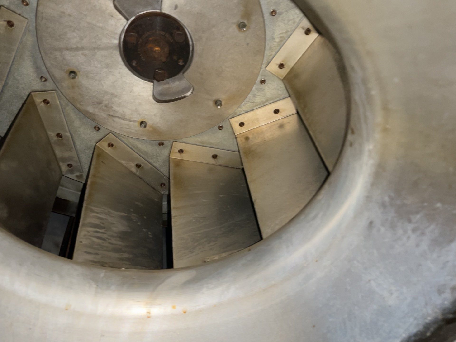 Kitchen exhaust fan wheel cleaned to bare metal